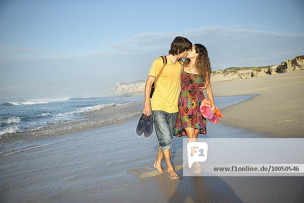 South Africa  kissing couple walking on the beach