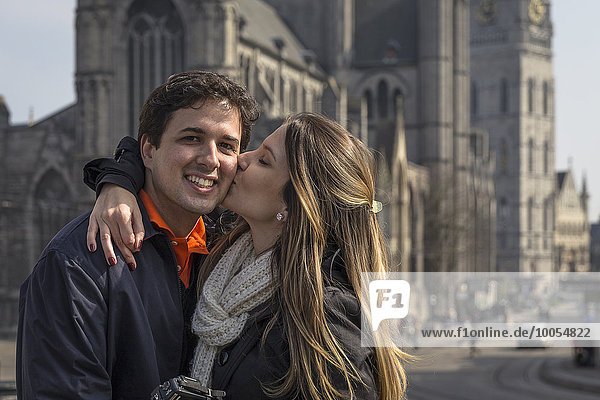 Romantic couple in front of St Bavo's Cathedral  Ghent  Flanders  Belgium