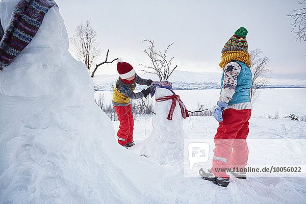 Two boys making snowmen   Hemavan Sweden