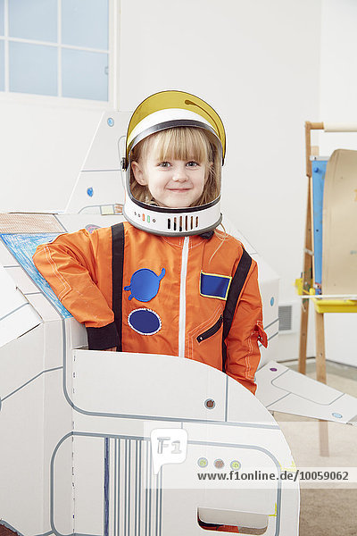 Portrait of young girl  wearing astronaut outfit
