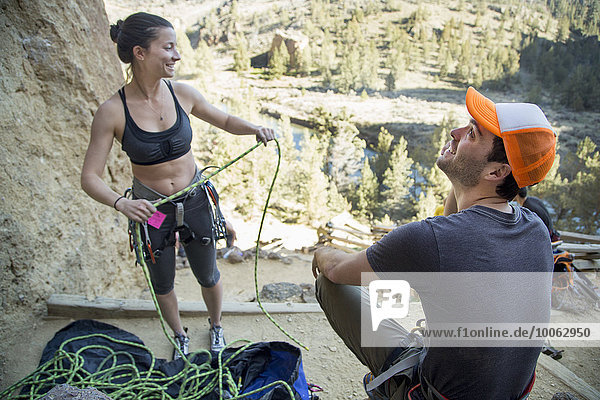 Rock climber preparing rope  Smith Rock State Park  Oregon