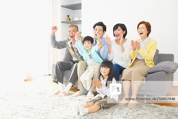 Three-generation Japanese family on the sofa in the living room