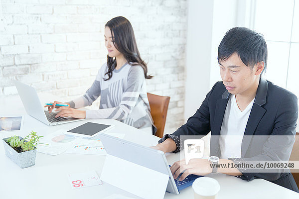 Japanese people working in modern office