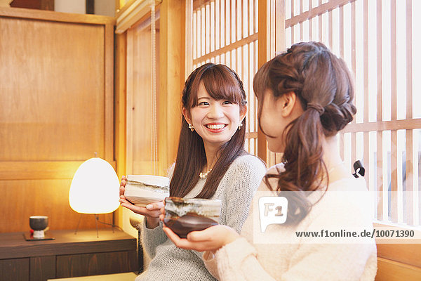 Young Japanese women enjoying Maccha green tea in Kawagoe  Japan