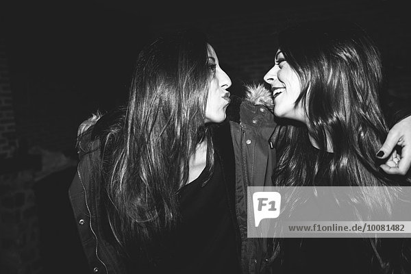 Smiling women laughing at party