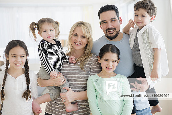 Caucasian parents and children smiling