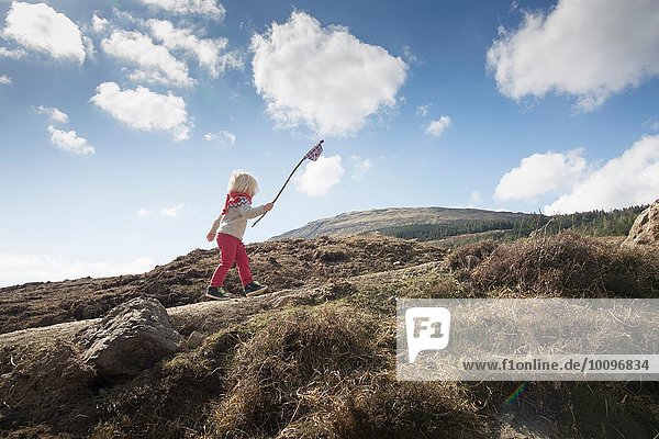 Boy carrying flag  Fairy Pools  Isle of Skye  Hebrides  Scotland