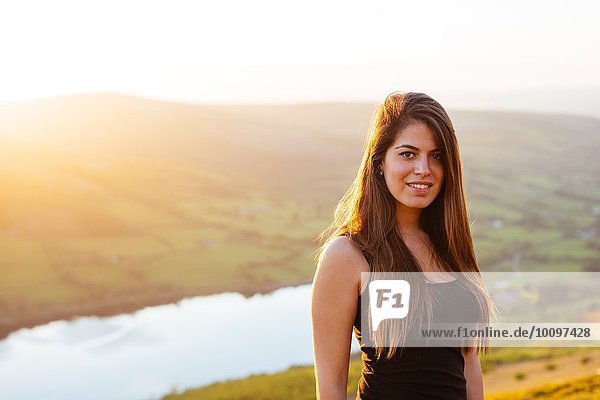 Portrait of young woman  Talybont Reservoir in Glyn Collwn valley  Brecon Beacons  Powys  Wales