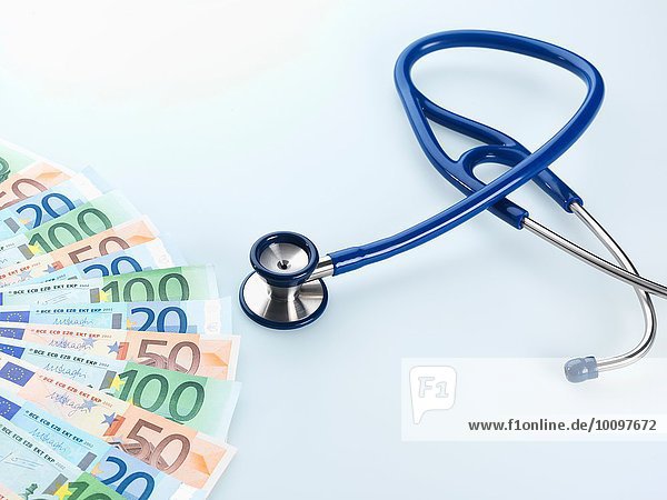 Stethoscope next to Euro notes