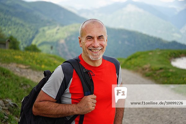 Portrait of mature male hiker on rural road  Grigna  Lecco  Lombardy  Italy