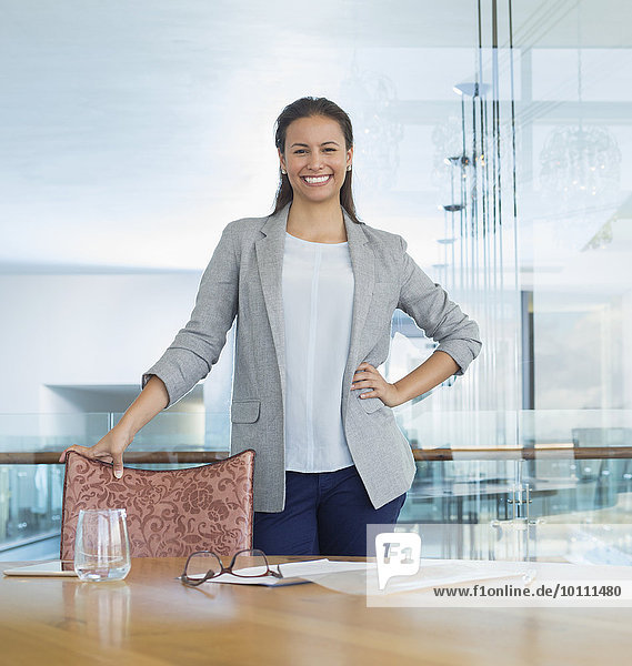 Portrait confident businesswoman in conference room
