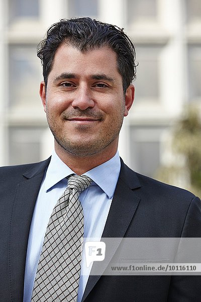 Portrait of mid adult business man  looking at camera  smiling