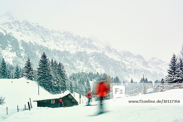Skiers moving down ski slope  Wengen  Switzerland