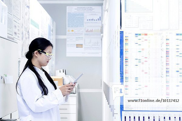 Female scientist looking at digital tablet in laboratory