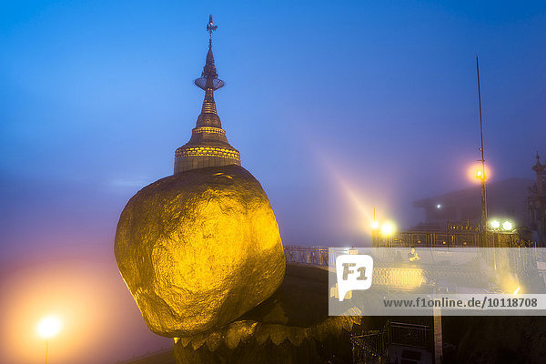 Golden Rock at dusk with Kyaiktiyo Pagoda Kyaikto Thaton District Mon State Myanmar Myanmar Asia