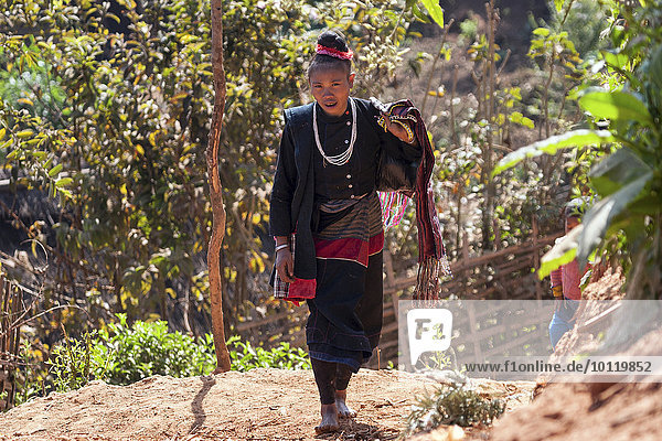 Native woman in typical clothing from the Ann tribe in a mountain village at Pin Tauk  Shan State Golden Triangle  Myanmar  Asia