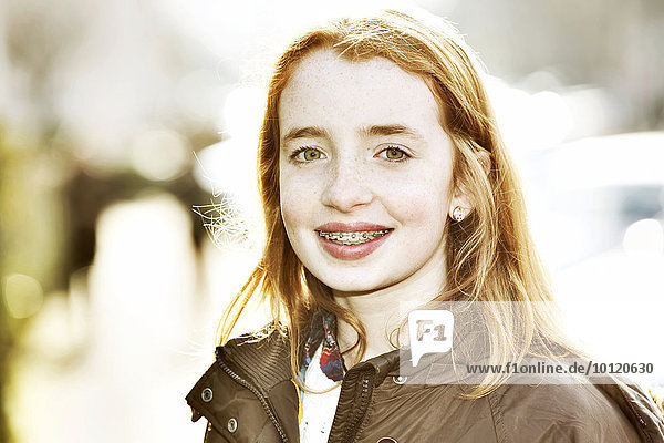 Portrait  girl with braces  redhead  outside  Germany  Europe