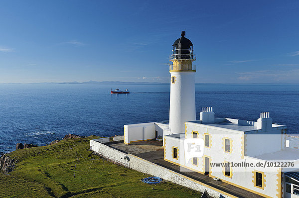 Fishing Boat and Rua Reidh Lighthouse  Melvaig  Gairloch  Wester Ross  Scotland  United Kingdom  Europe