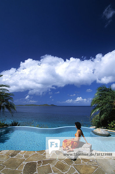 Woman at the spa pool of the Little Dix Bay Resort on Virgin Gorda Island  British Virgin Islands  Caribbean  North America