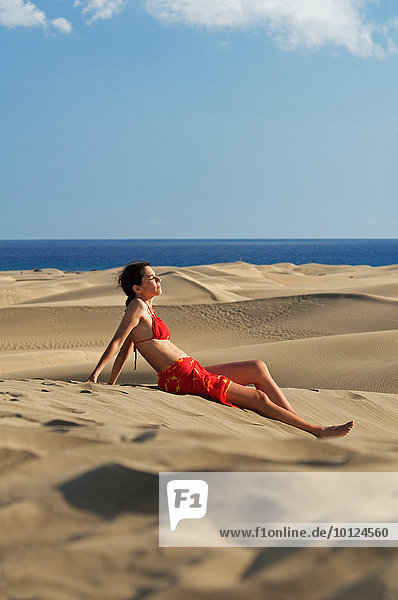Woman in the sand dunes of Maspalomas  Gran Canaria  Canary Islands  Spain  Europe