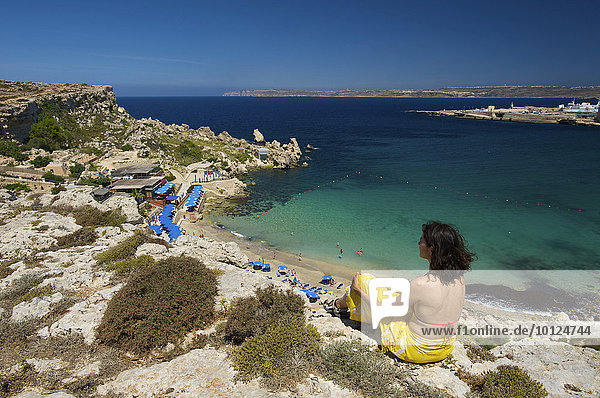 Woman looking on Paradise Bay in Cirkewwa  Malta  Europe