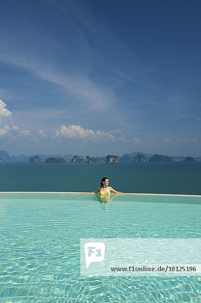 Woman in the private pool of a suite in a luxury hotel  Evason Six Senses Hideaway on Yao Noi island near the island of Phuket  Phang Nga Bay  Thailand  Asia