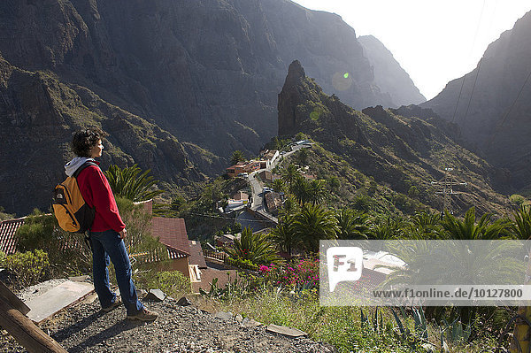 Tourist overlooking the mountain village of Masca  Tenerife  Canary Islands  Spain  Europe