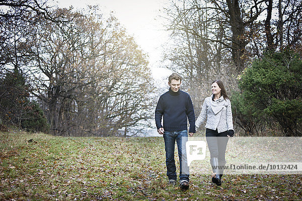 Young couple walking in forest