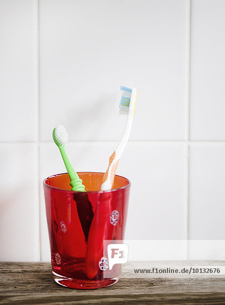 Toothbrushes in glass