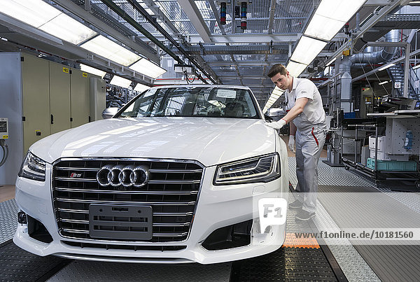 Audi AG employee conducting the first run of an assembled A8 sedan  production line  Audi factory in Neckarsulm  Baden-Württemberg  Germany  Europe