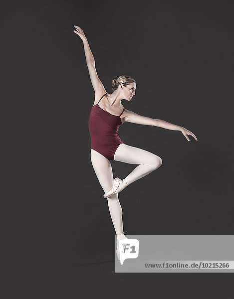 Caucasian ballet dancer posing on pointe