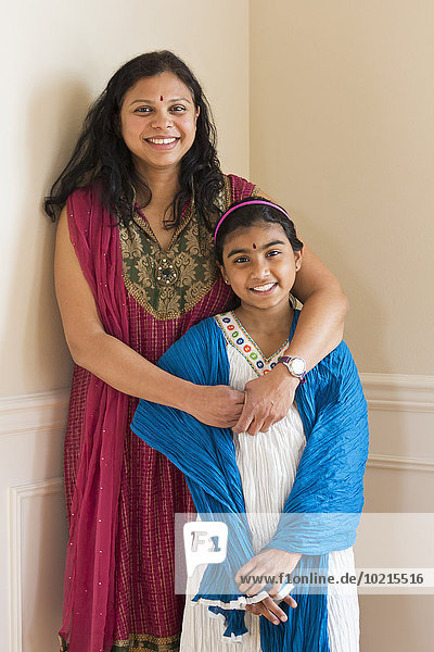 Indian mother and daughter wearing traditional dresses