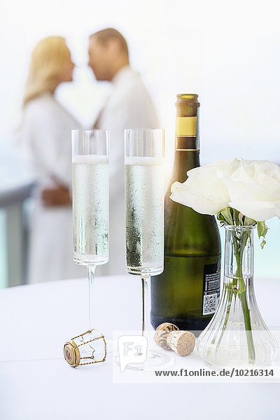 Close up of champagne glasses on balcony table