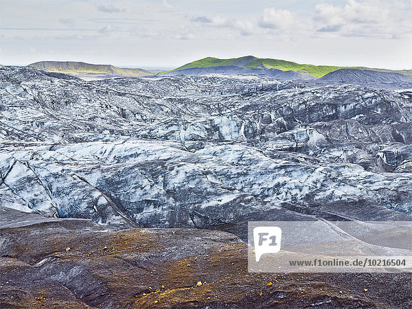 Snow on remote rock formations Myrdalsjokull Glacier South Iceland Iceland