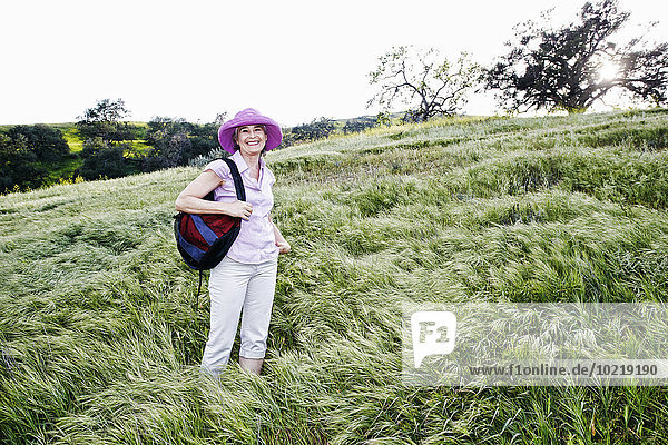 Caucasian woman standing on hillside