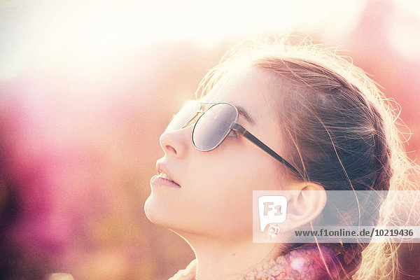 Caucasian teenage girl wearing sunglasses