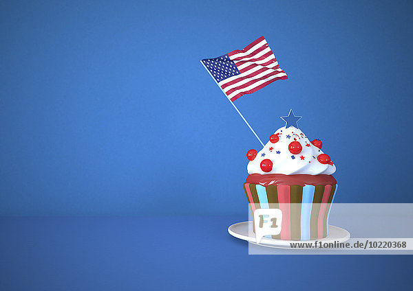 Cupcake mit US-amerikanischer Flagge auf blauem Hintergrund