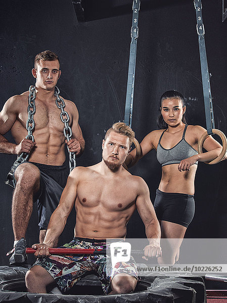 Drei CrossFit-Athleten posieren