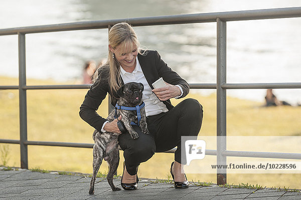 Businesswoman with her pug