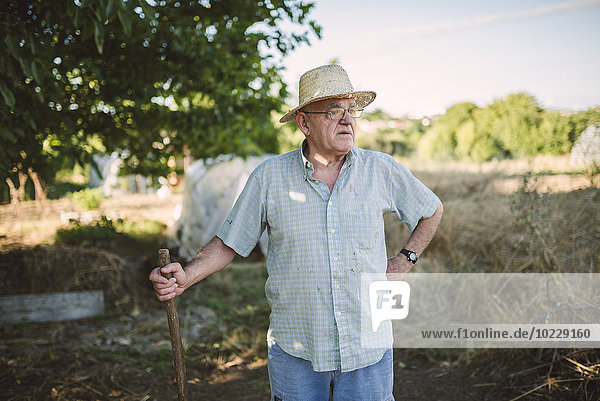 Portrait of farmer wearing straw hat