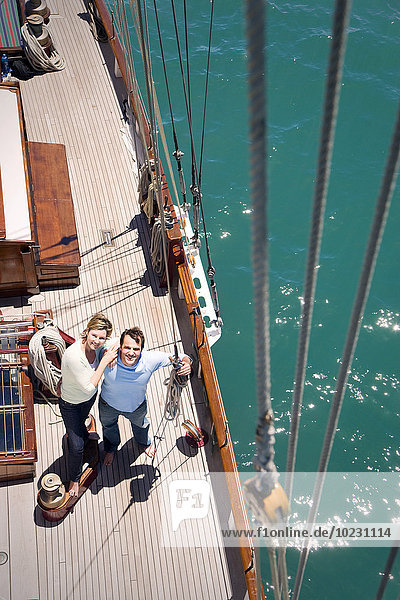 Mature couple on deck of a sailing ship