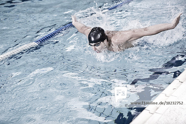 Swimmer training in indoor pool