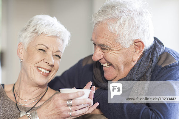 Laughing senior couple