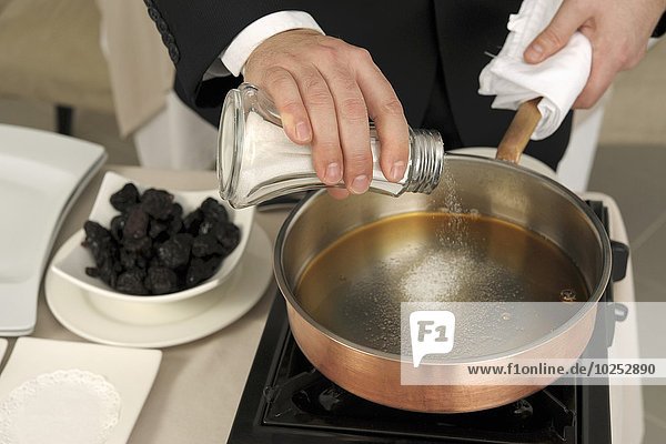 Preparing prunes flambé