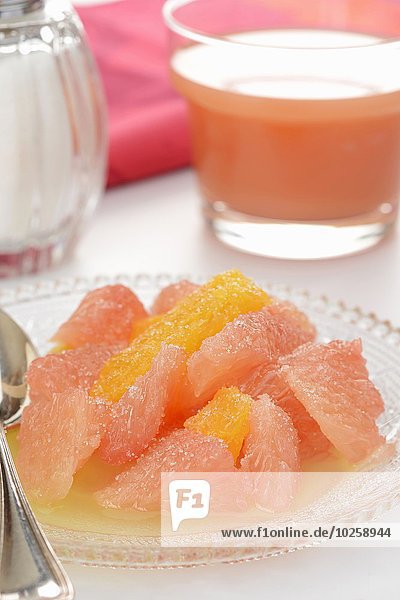 Pink and yellow grapefruit salad in pineapple juice