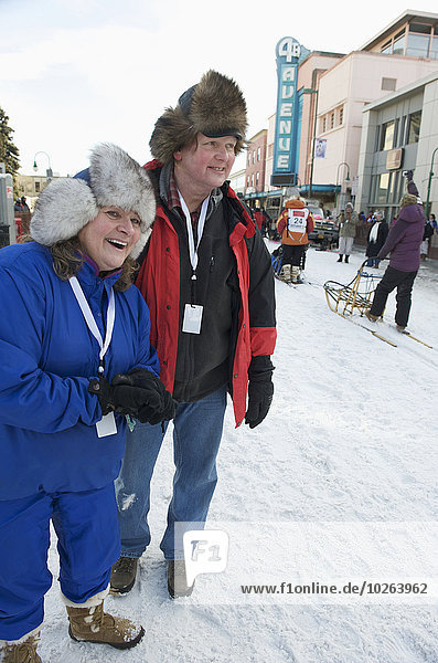 Spectators cheer on the dog teams and mushers at the start of the 2011 Iditarod Race in downtown Anchorage  Alaska