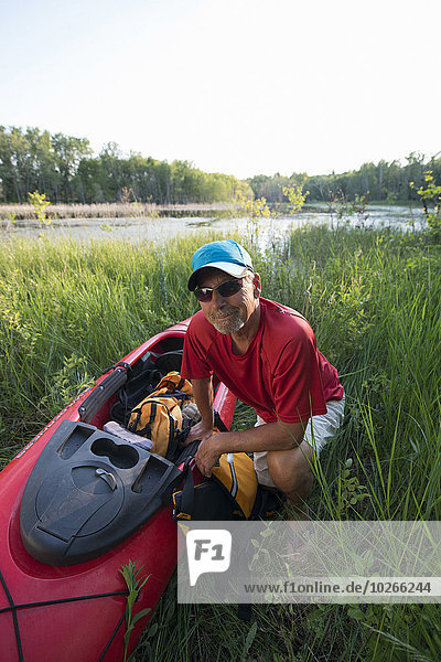 Portrait of Senior Man with Kayak  Saskatchewan  Canada