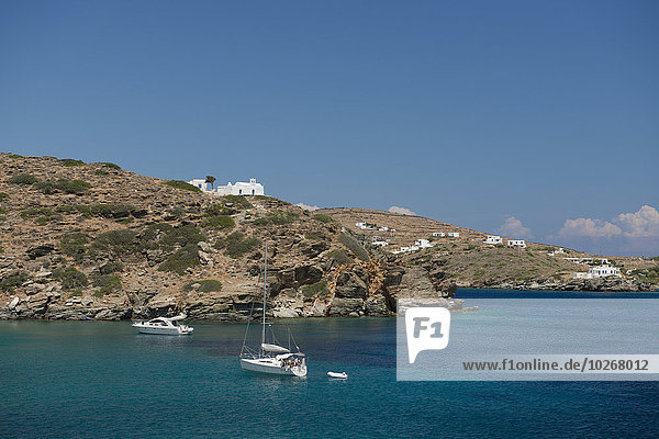 Yachts moored in Apokofto Bay in Southestern Sifnos; Sifnos  Cyclades  Greek Islands  Greece