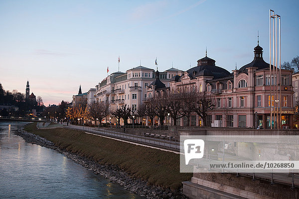 The historic centre seen from the Salzach river at dusk; Salzburg  Austria
