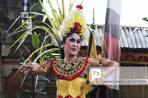 Balinese dancer using codified hand positions and gestures at a Barong dance performance in Batubulan  Bali  Indonesia